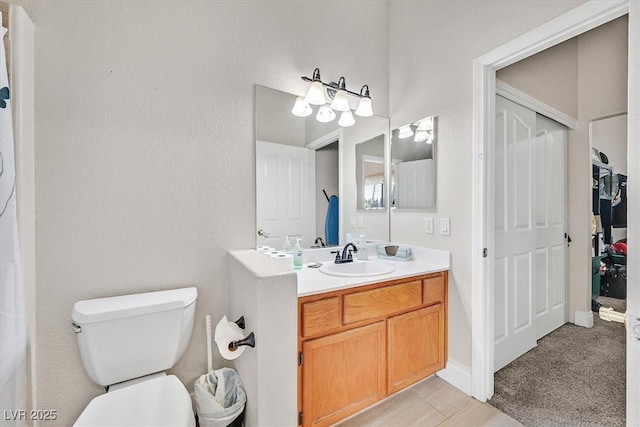 full bath featuring toilet and vanity