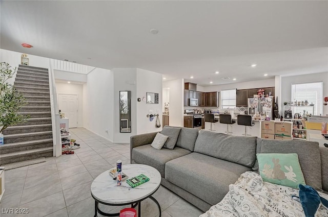 6747 Marjoram St, Las Vegas, NV 89166 - living room with stairs, light tile patterned floors, and recessed lighting