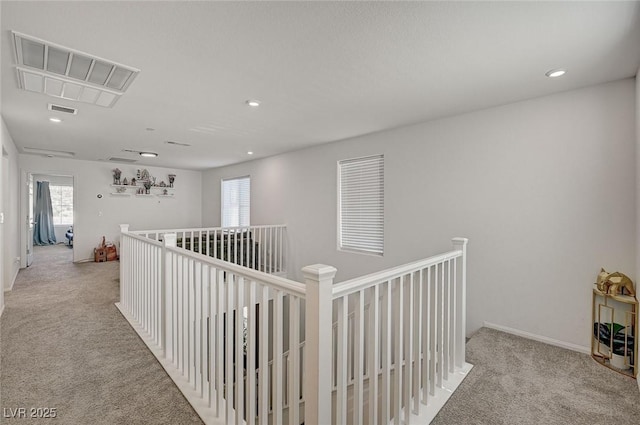 6747 Marjoram St, Las Vegas, NV 89166 - corridor featuring light colored carpet, plenty of natural light, an upstairs landing, recessed lighting, and baseboards