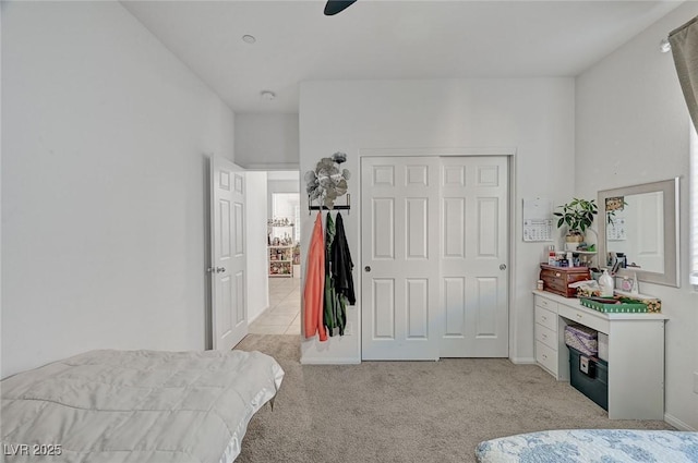 6747 Marjoram St, Las Vegas, NV 89166 - bedroom with light colored carpet, a closet, and ceiling fan