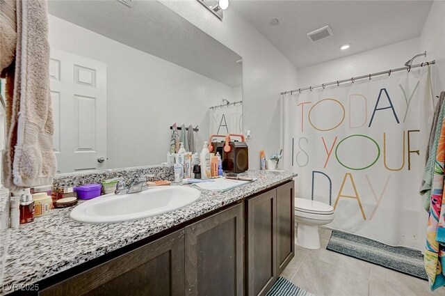 6747 Marjoram St, Las Vegas, NV 89166 - bathroom featuring vanity, tile patterned floors, and toilet