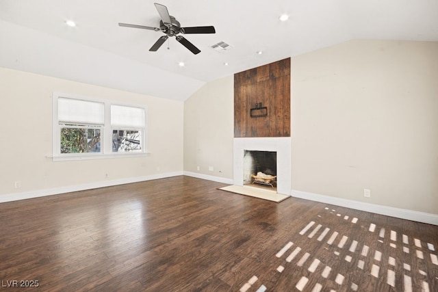 unfurnished living room featuring a fireplace, wood finished floors, visible vents, baseboards, and vaulted ceiling