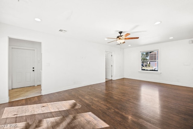 unfurnished room featuring recessed lighting, visible vents, baseboards, and wood finished floors