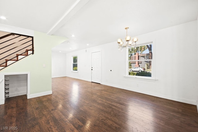 unfurnished living room featuring recessed lighting, stairway, an inviting chandelier, wood finished floors, and baseboards