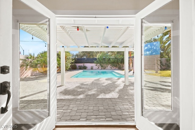 doorway to outside with brick floor and plenty of natural light