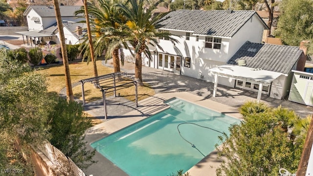 exterior space with french doors, a patio, fence, and stucco siding