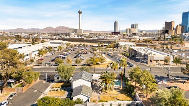 drone / aerial view featuring a view of city and a mountain view