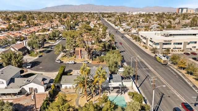 drone / aerial view featuring a residential view and a mountain view