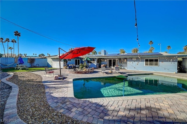 view of pool with a fenced in pool and a patio area