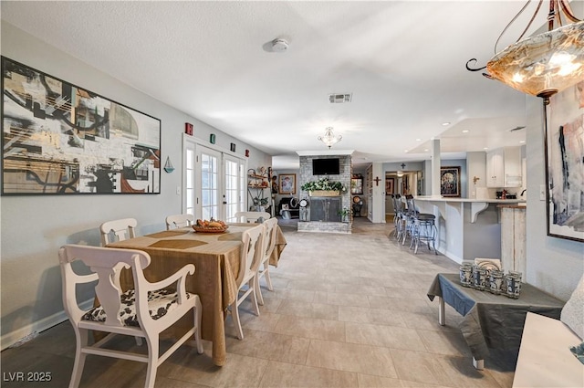 dining space featuring visible vents, french doors, and baseboards