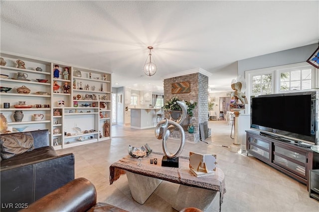 living room with a chandelier and a textured ceiling