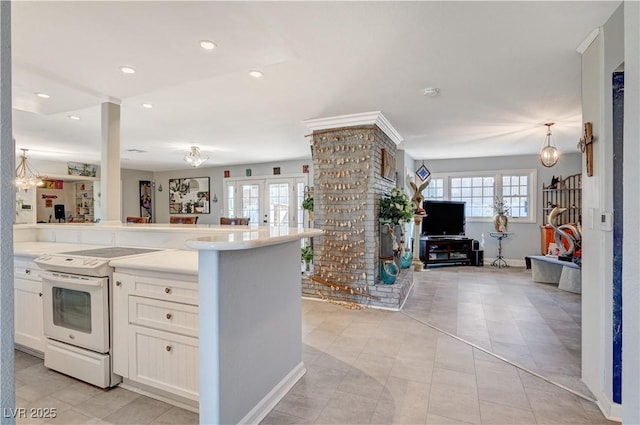 kitchen featuring white cabinets, plenty of natural light, open floor plan, and white electric stove