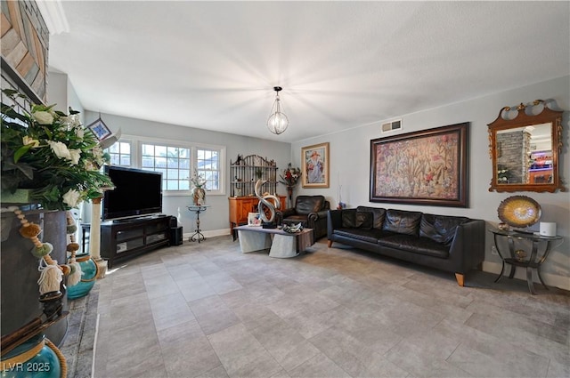 living room with visible vents and baseboards