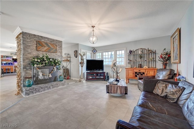 living room with a chandelier, a brick fireplace, and a textured ceiling