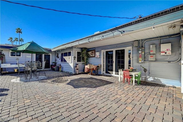 back of property with a patio