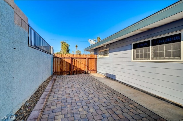 view of patio / terrace with a gate and fence