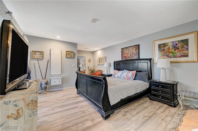 bedroom with baseboards and light wood-style floors