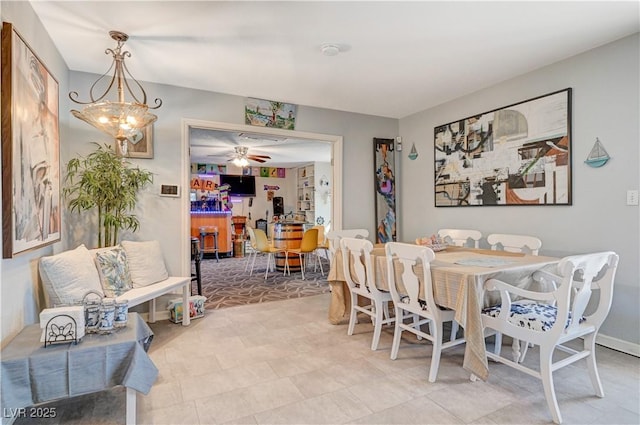 dining room with a ceiling fan