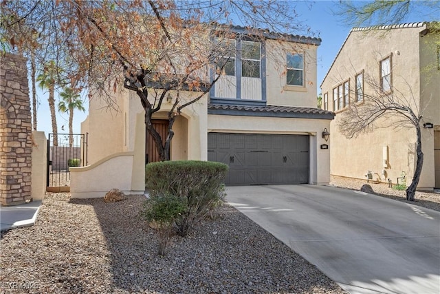 view of front of property with driveway, an attached garage, a tile roof, and stucco siding