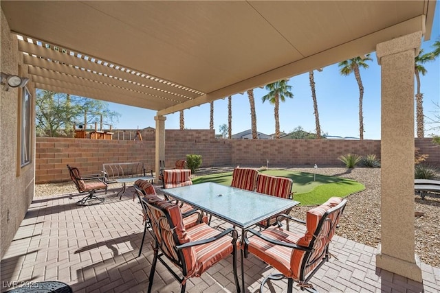 view of patio with a fenced backyard, a pergola, and outdoor dining space