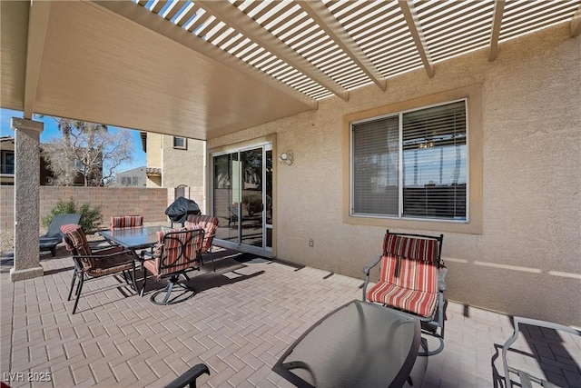 view of patio with fence, a pergola, and outdoor dining space