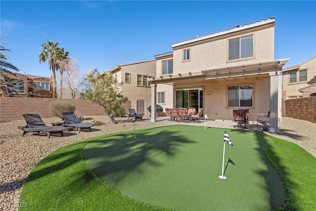 back of property featuring a patio area, a fenced backyard, and stucco siding