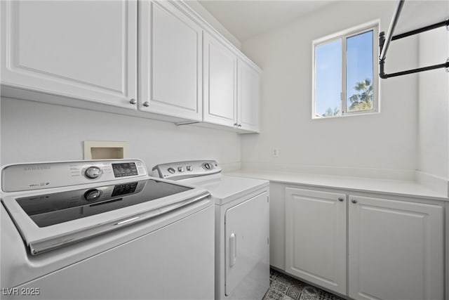 laundry area with cabinet space and independent washer and dryer