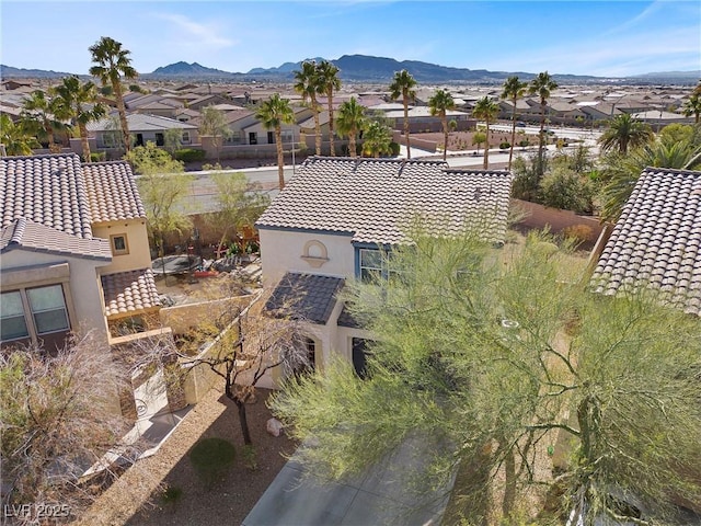 birds eye view of property with a residential view and a mountain view