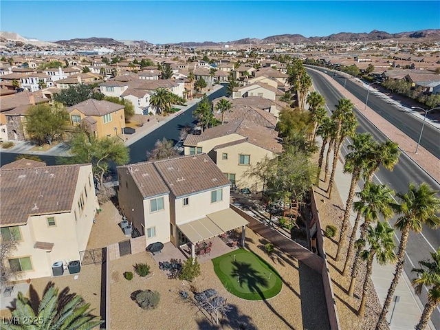 birds eye view of property with a residential view and a mountain view