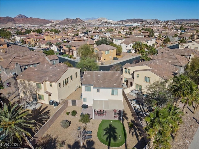 drone / aerial view with a residential view and a mountain view