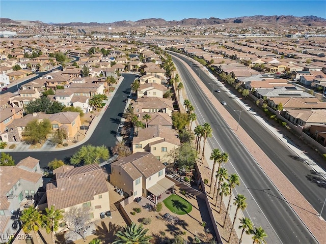 drone / aerial view featuring a residential view and a mountain view