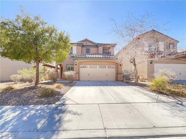 view of front of home with a garage, concrete driveway, a tile roof, and stucco siding