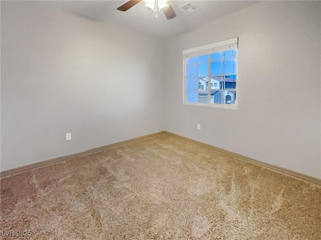 empty room with a ceiling fan, visible vents, carpet floors, and baseboards