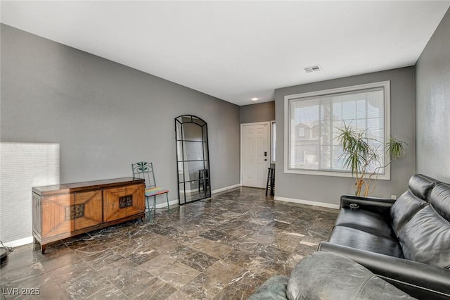 living room with visible vents and baseboards