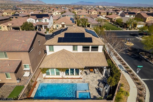 drone / aerial view featuring a residential view and a mountain view