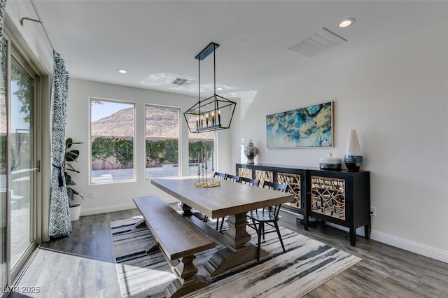 dining space with recessed lighting, visible vents, baseboards, and wood finished floors