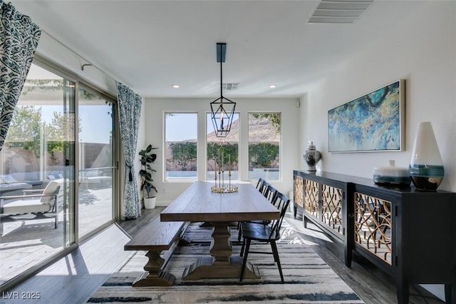 dining space featuring recessed lighting, visible vents, and wood finished floors