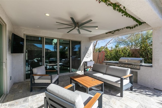 view of patio / terrace with a ceiling fan, area for grilling, grilling area, fence, and outdoor lounge area