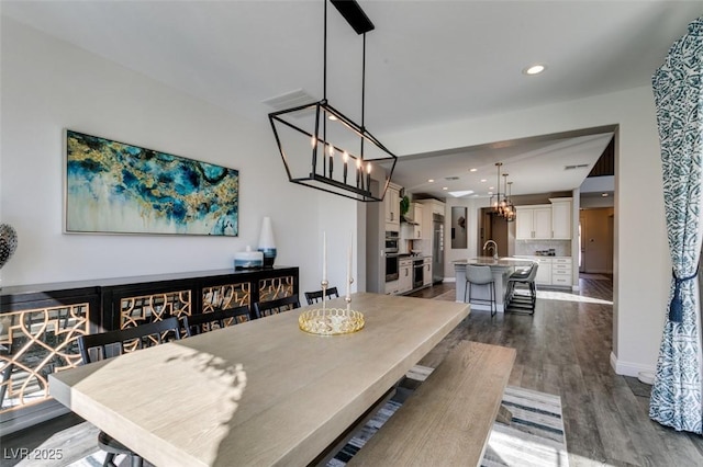 dining area featuring dark wood-type flooring, recessed lighting, and baseboards