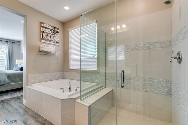 full bathroom featuring a shower stall, wood finished floors, a garden tub, and connected bathroom