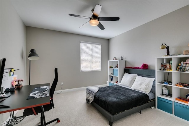 carpeted bedroom featuring ceiling fan and baseboards