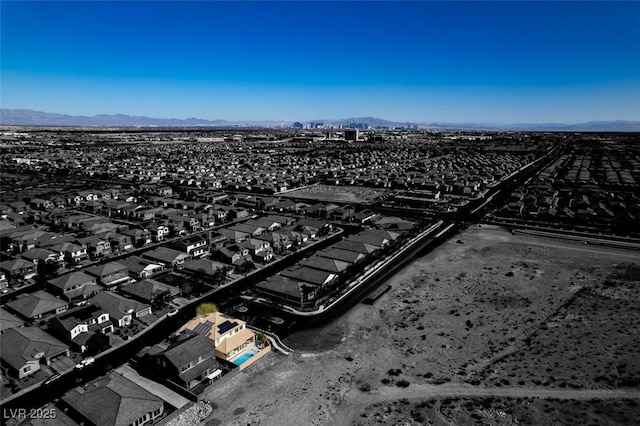 birds eye view of property featuring a mountain view