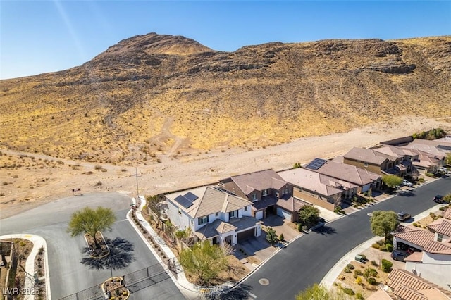 birds eye view of property with a mountain view