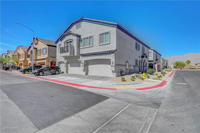 view of road with a residential view, curbs, sidewalks, and street lights