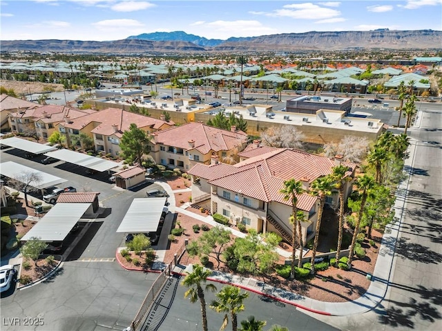 birds eye view of property featuring a mountain view and a residential view