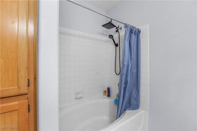 bathroom featuring shower / tub combo with curtain