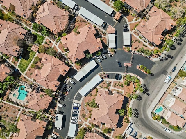 birds eye view of property with a residential view