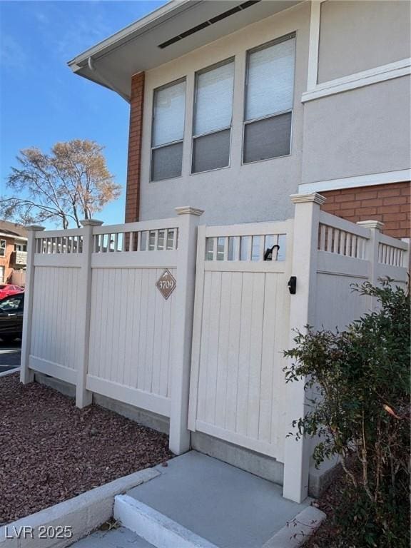 view of gate featuring fence