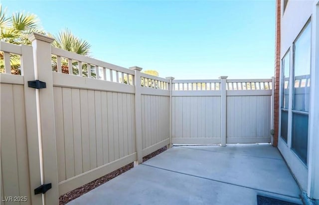 view of patio / terrace featuring a gate and fence