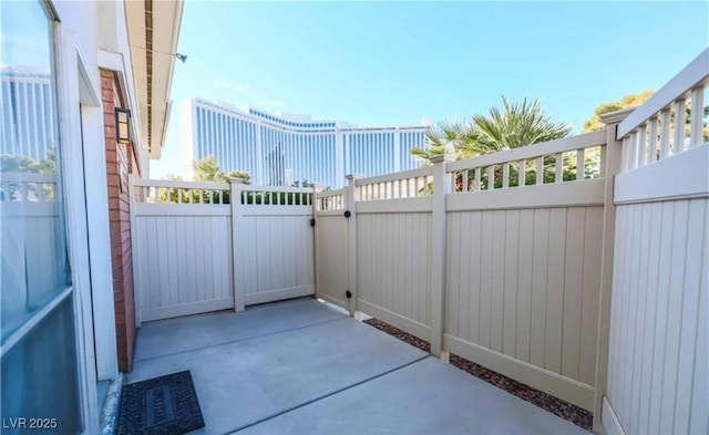 view of patio featuring a gate and fence